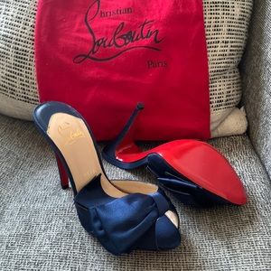 Christian Louboutin satin blue pumps with bag. Never worn! Brand new! Si…